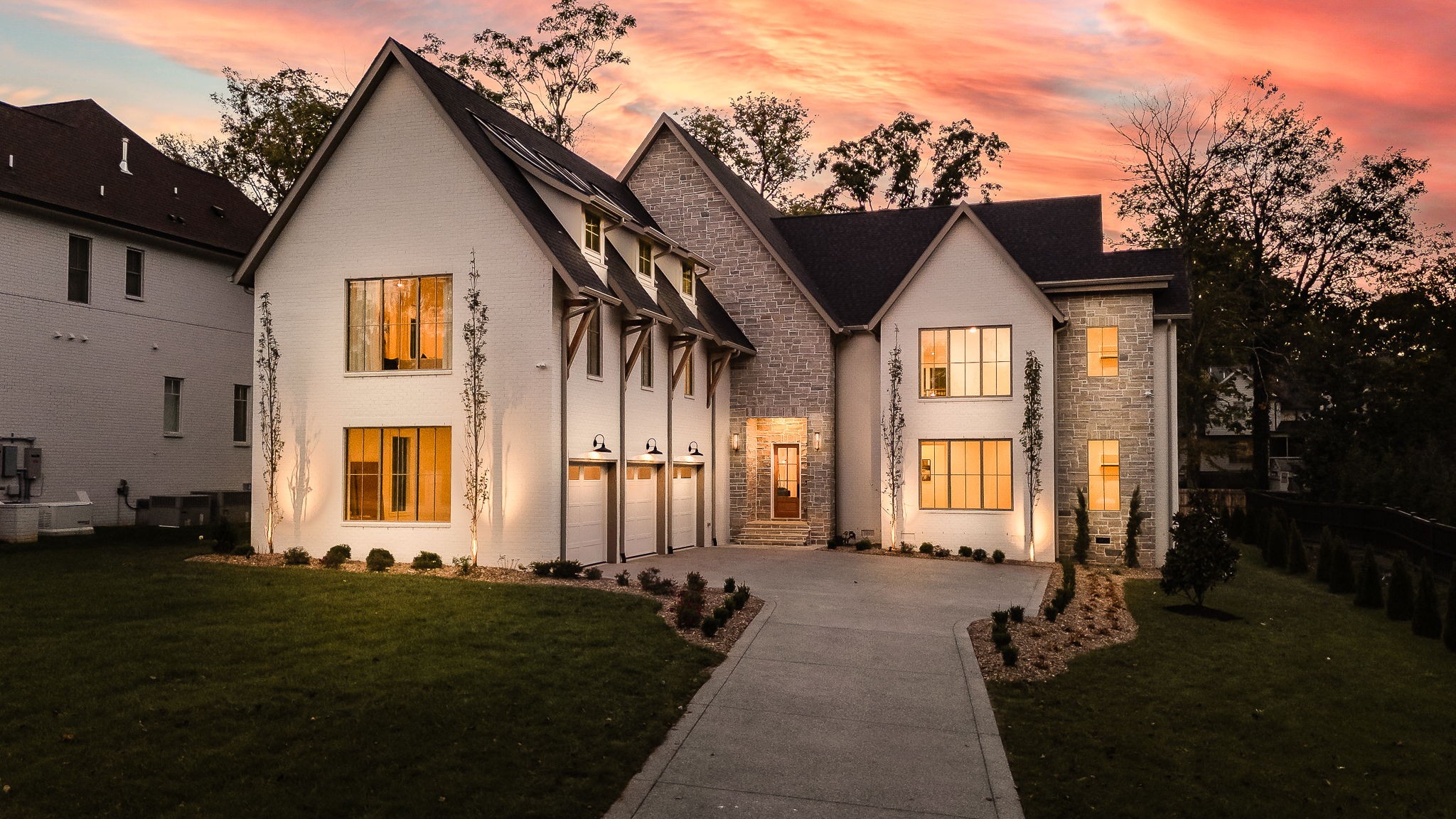 Twilight phot of the home at night, Handsome landscape lighting