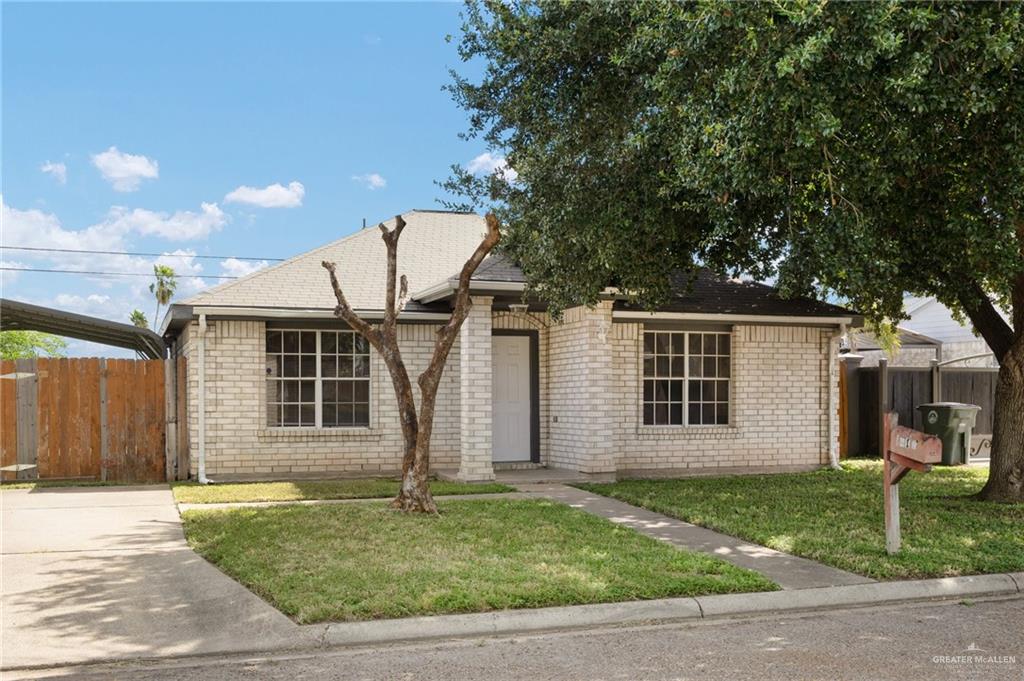 front view of a house with a yard