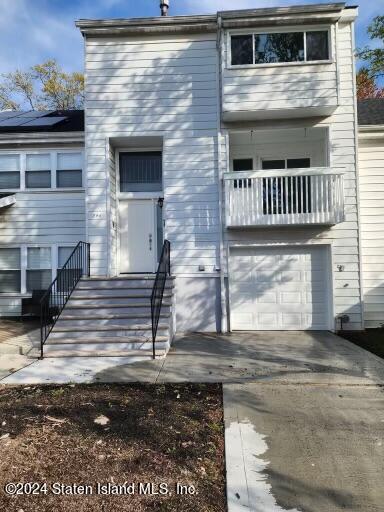 a view of front door of house with stairs