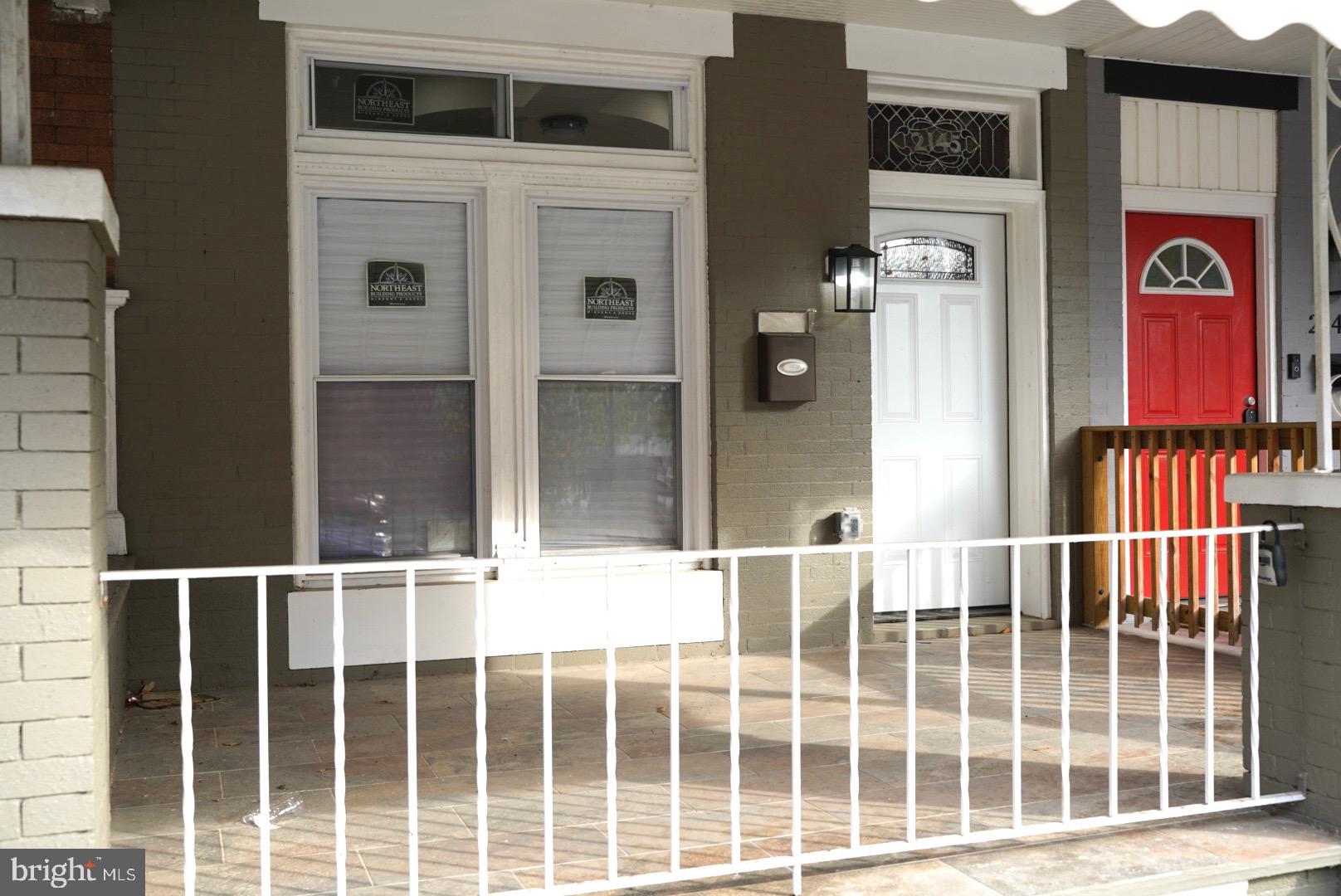 a balcony view with a glass door