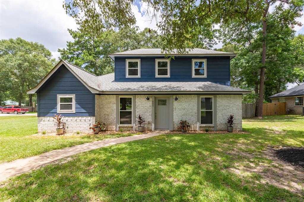 a front view of house with yard outdoor seating and barbeque oven