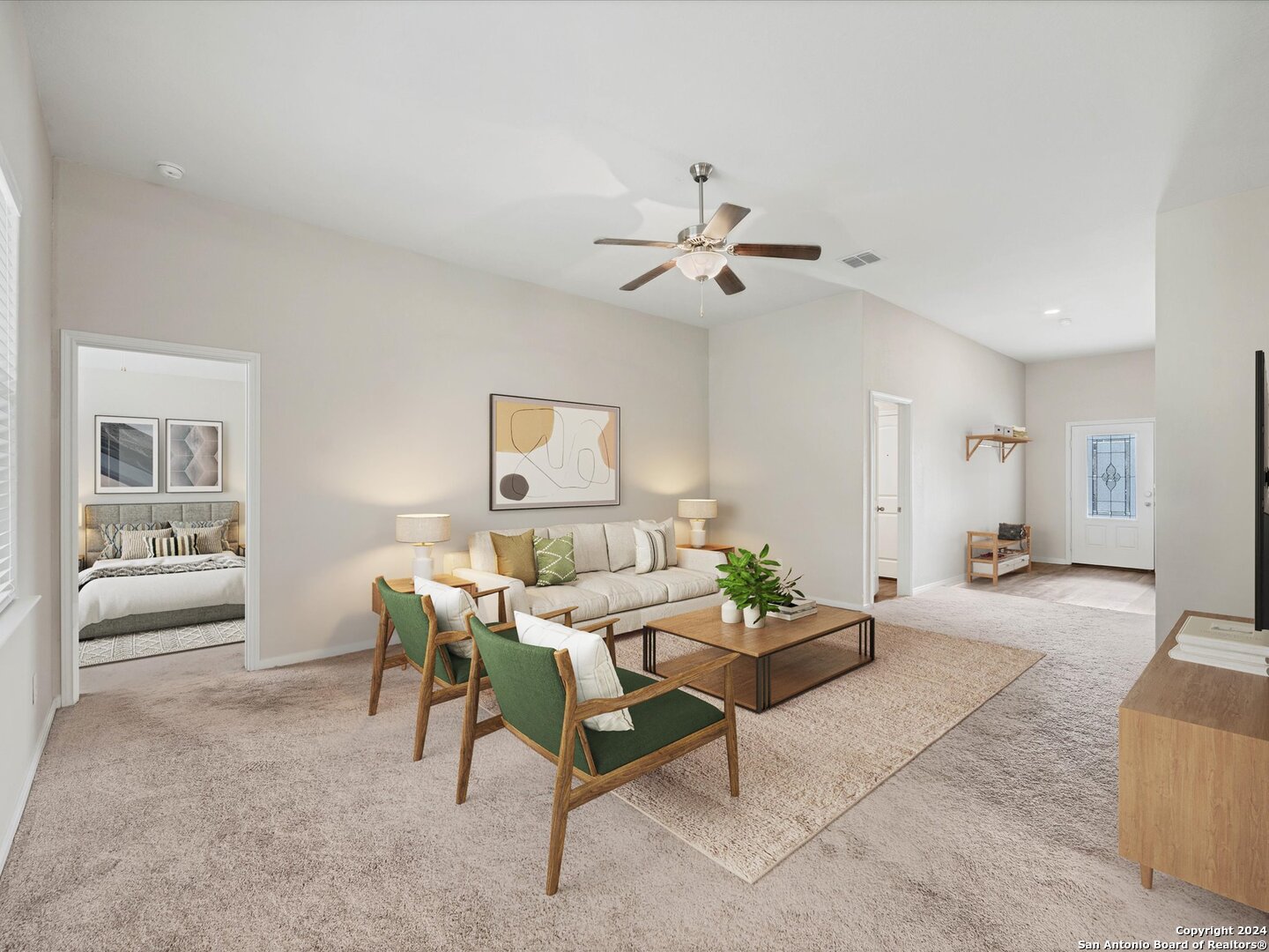 a living room with furniture and wooden floor