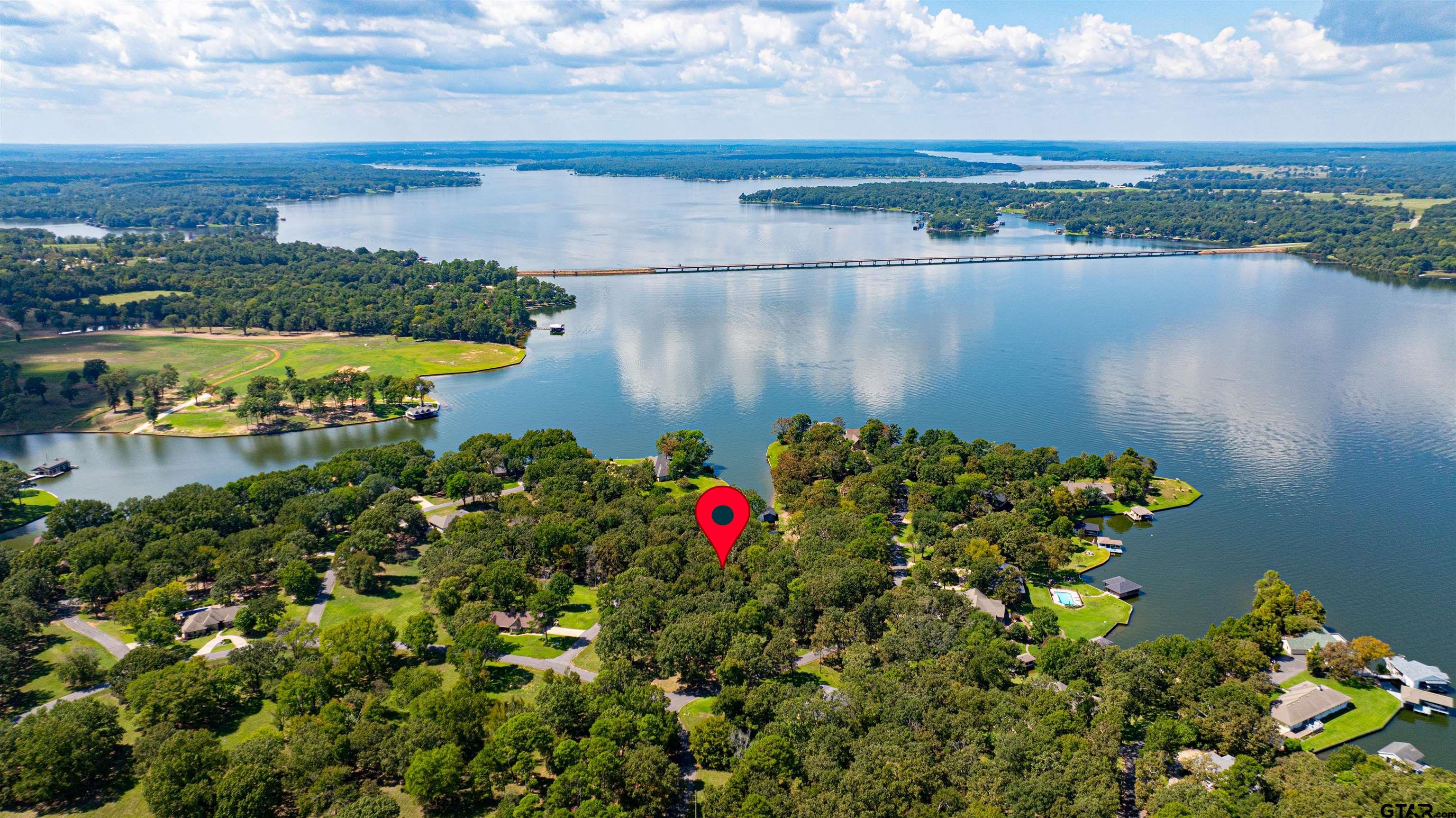 an aerial view of a houses with a lake view