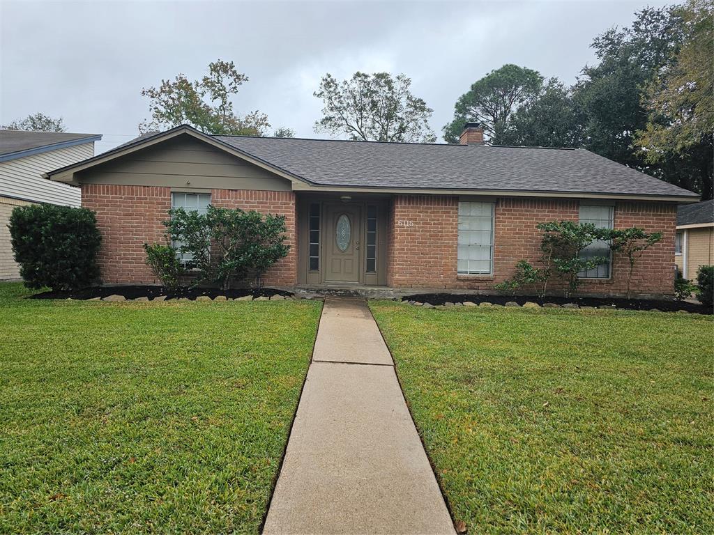 a front view of house with garden