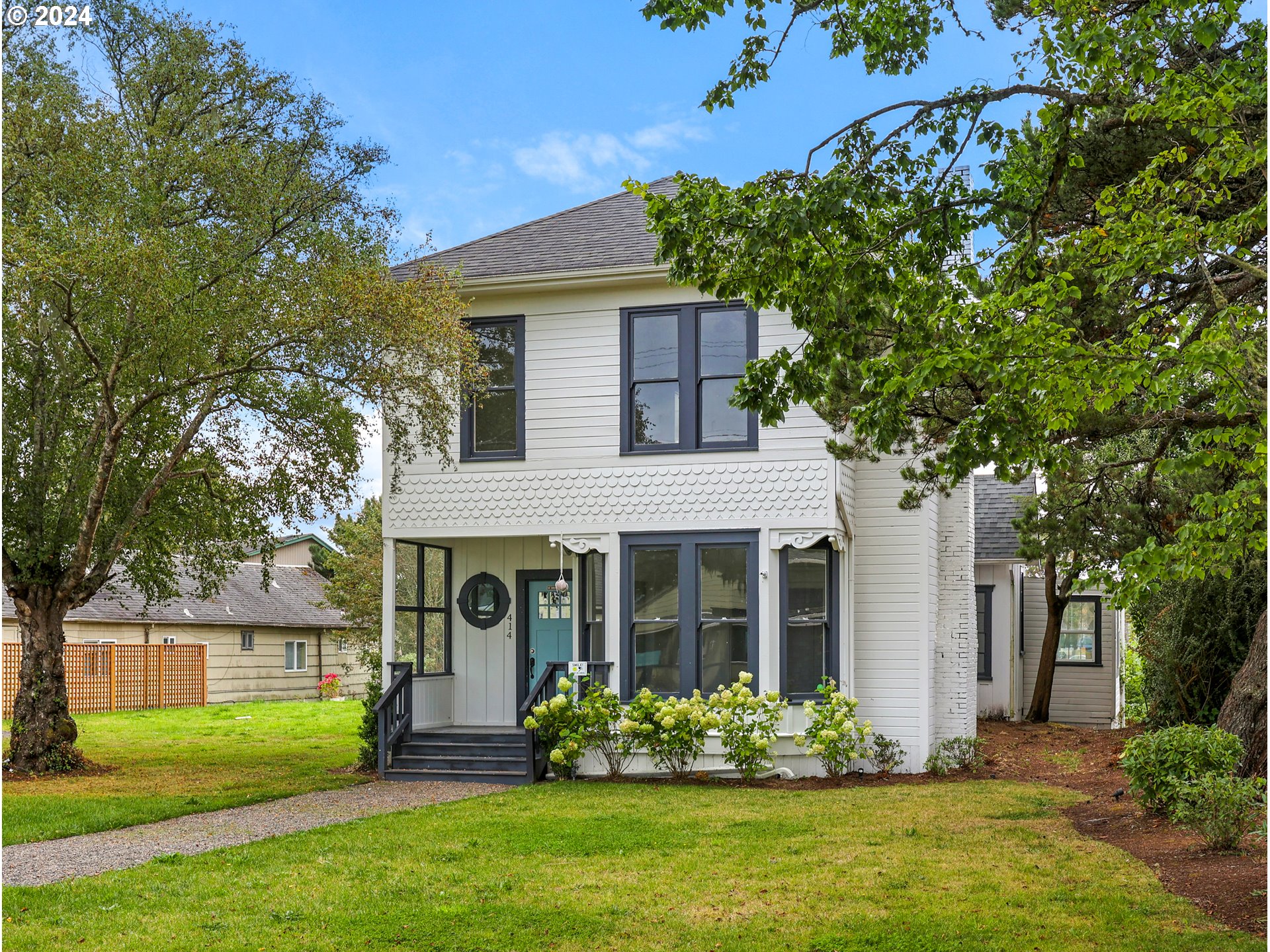 front view of a house with a yard