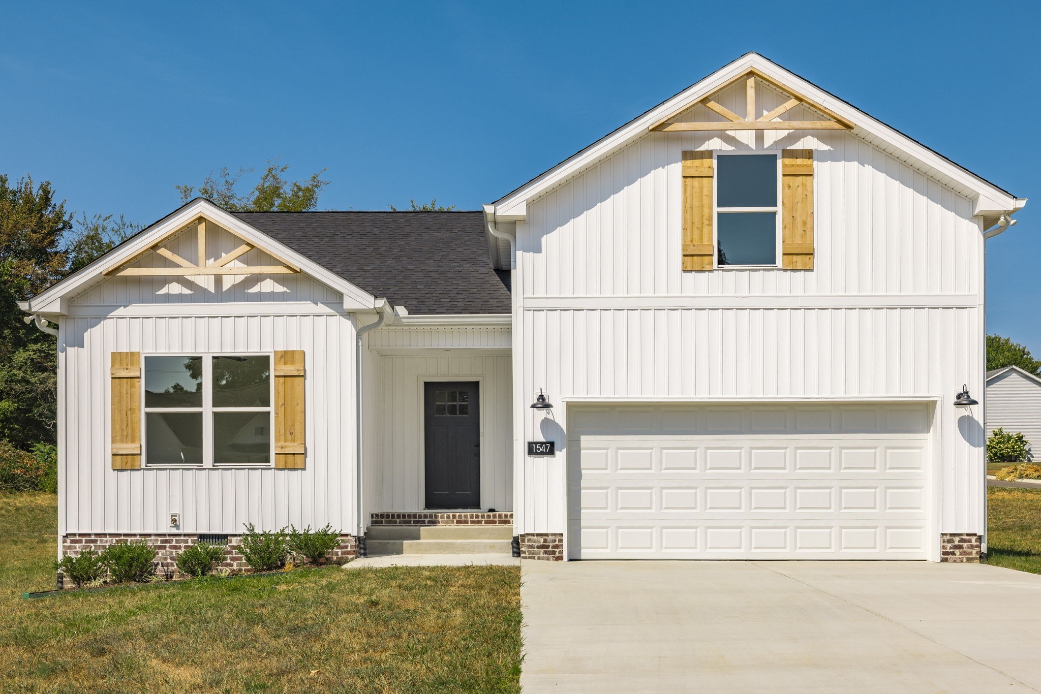 a front view of a house with garage