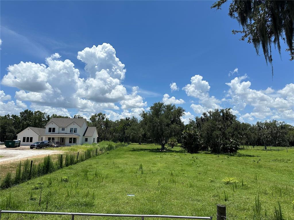 a view of a house with a big yard