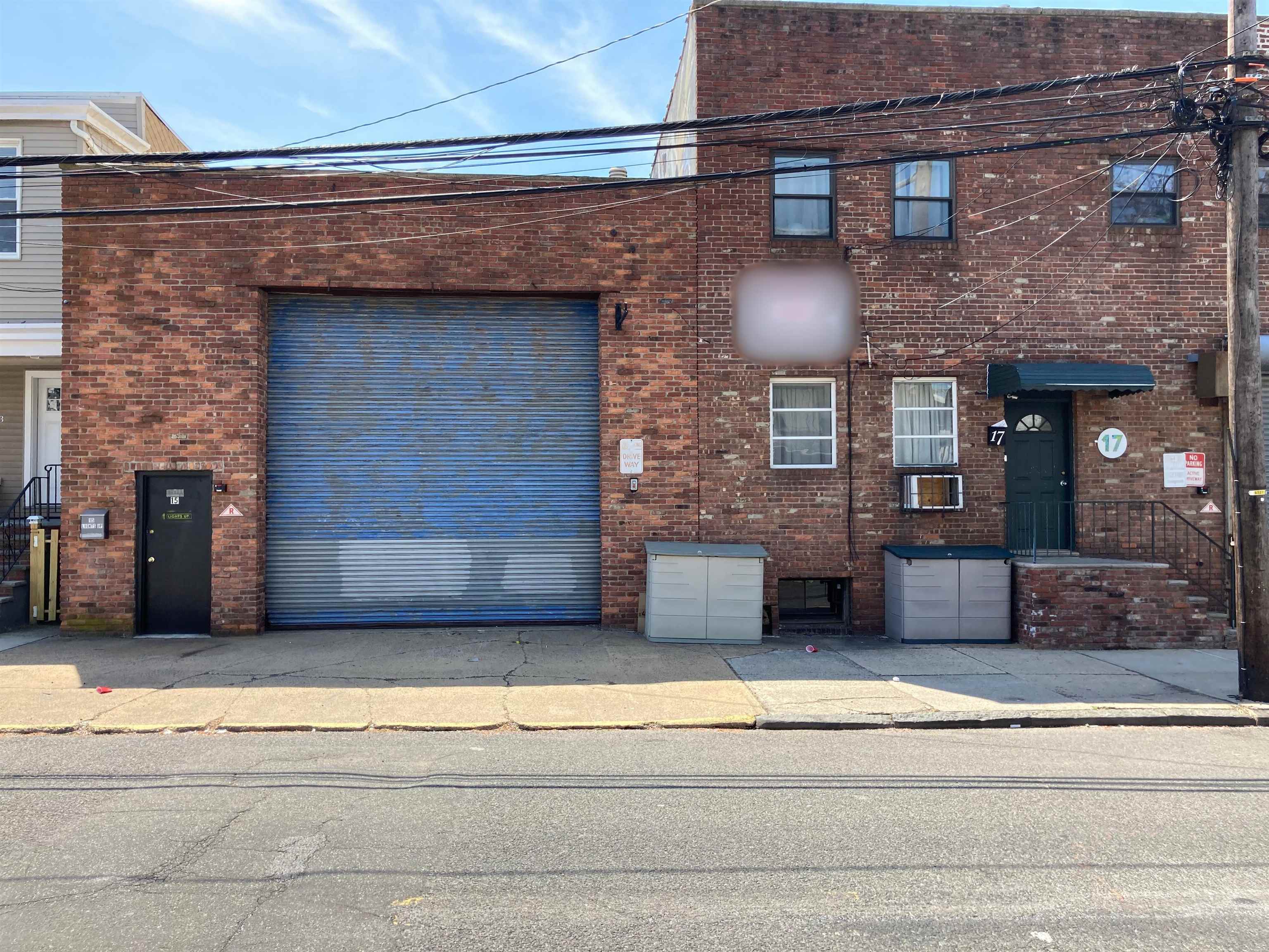 a view of a brick house with large windows