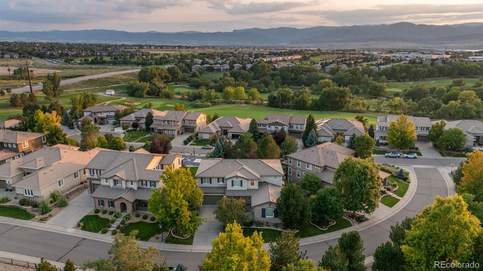 an aerial view of lake residential house with outdoor space and mountain view