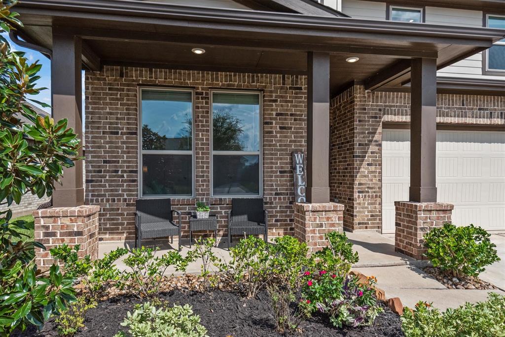 a front view of a house with outdoor seating