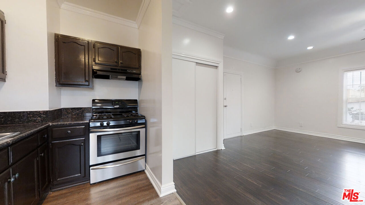 a kitchen with a stove and a microwave