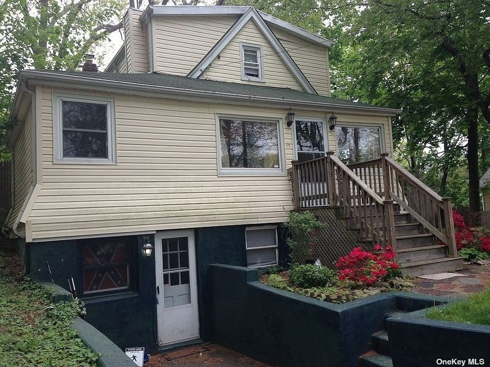 a front view of a house with fountain