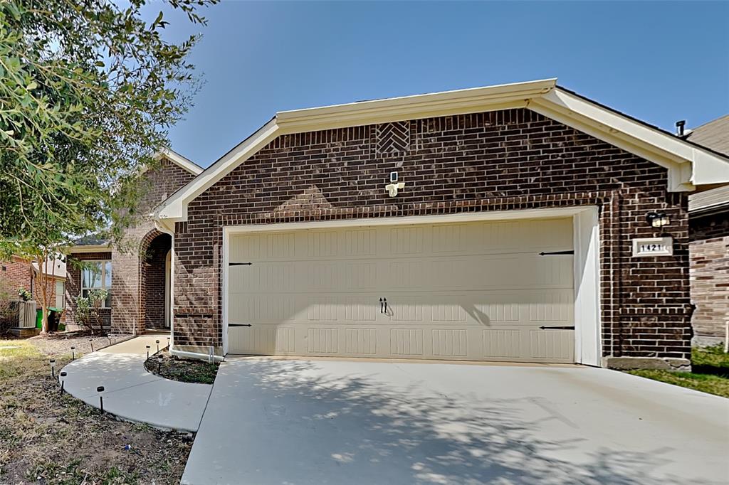 a front view of a house with garage