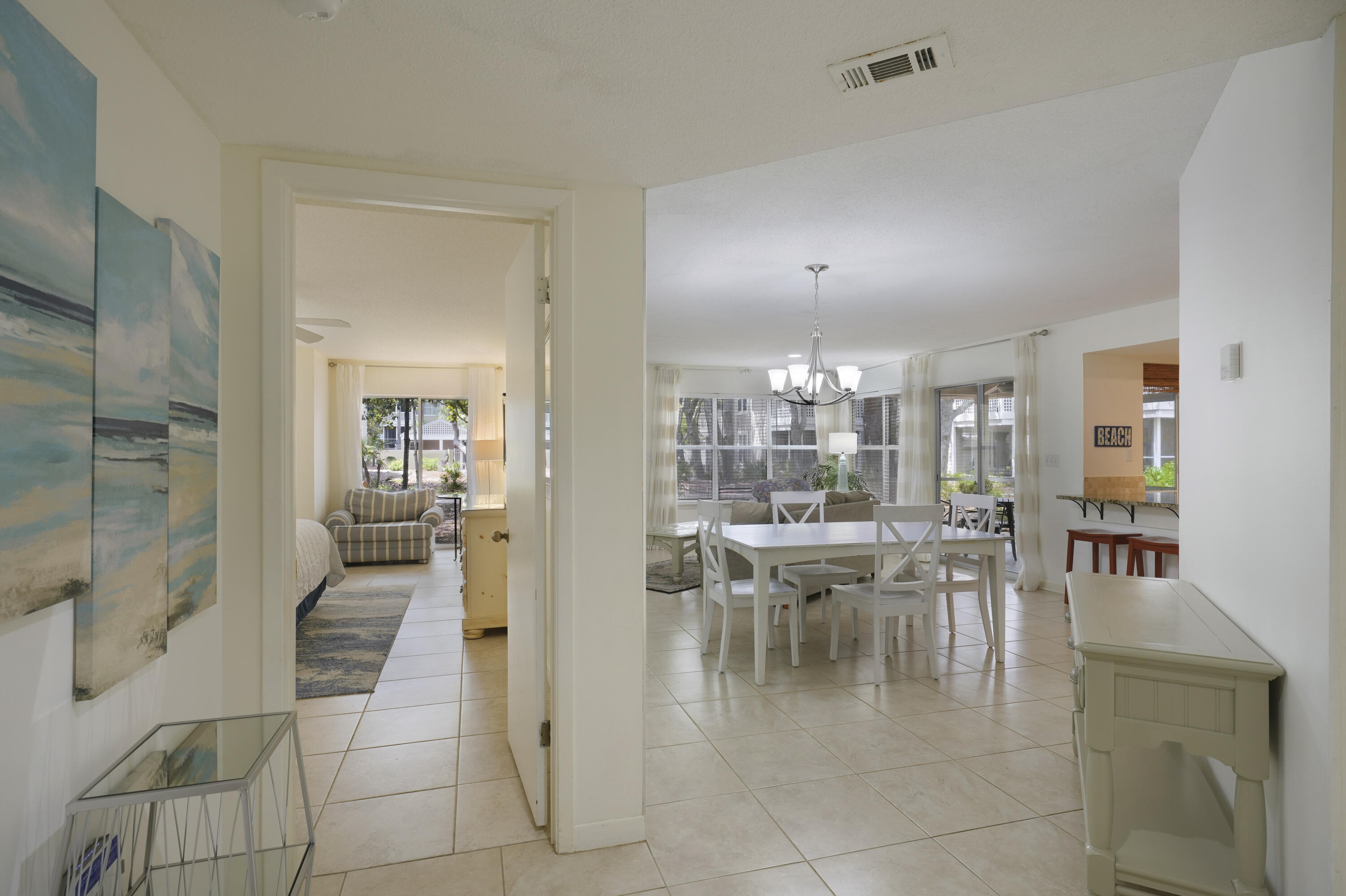 a dining room with furniture and a chandelier