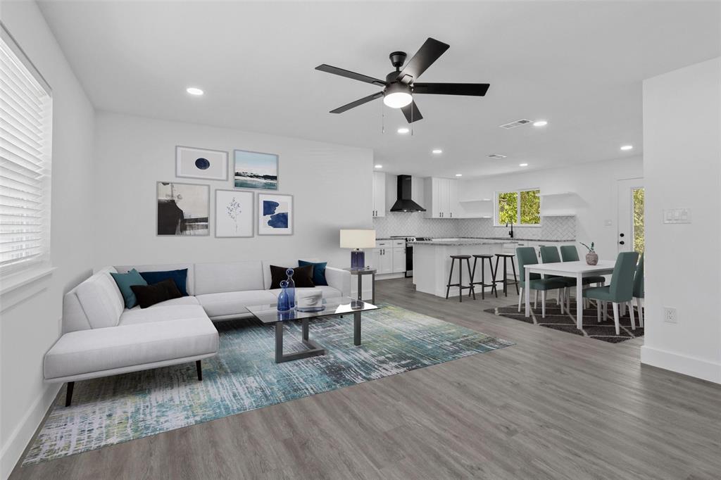 a living room with furniture and wooden floor