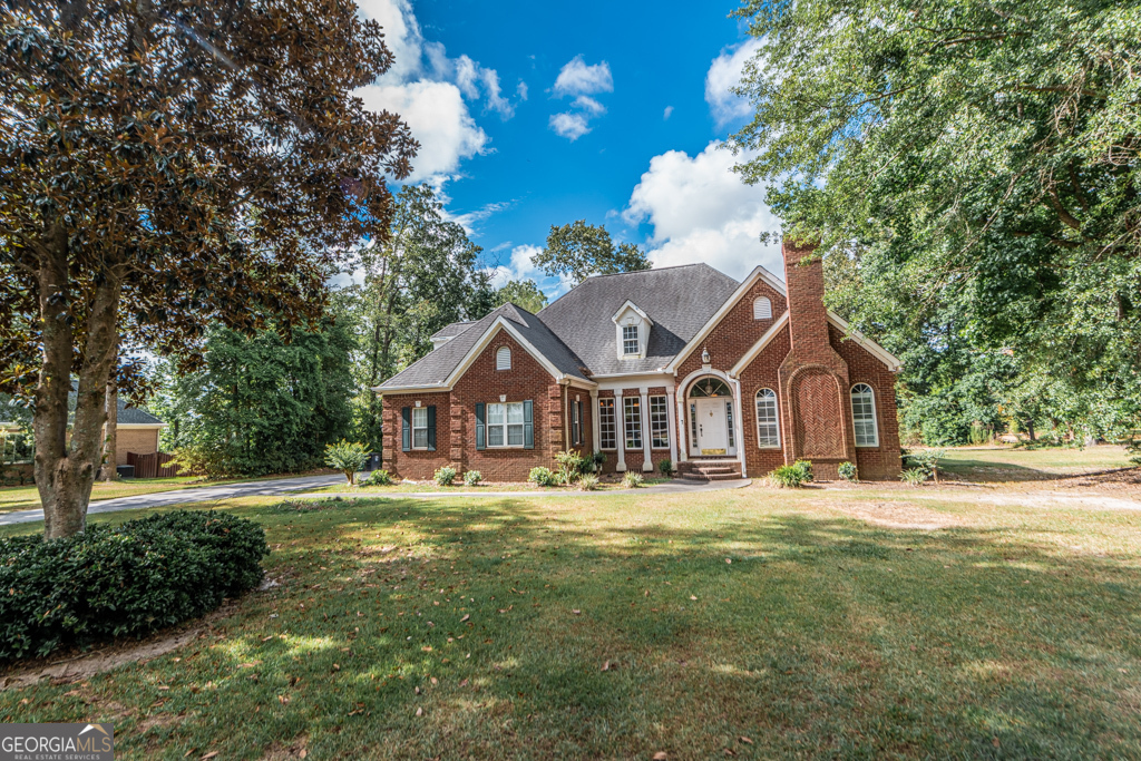 a front view of a house with a yard