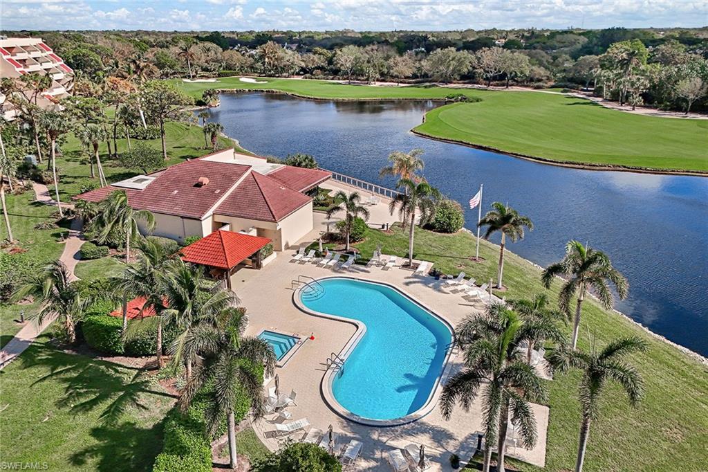 an aerial view of a house with yard swimming pool and outdoor seating