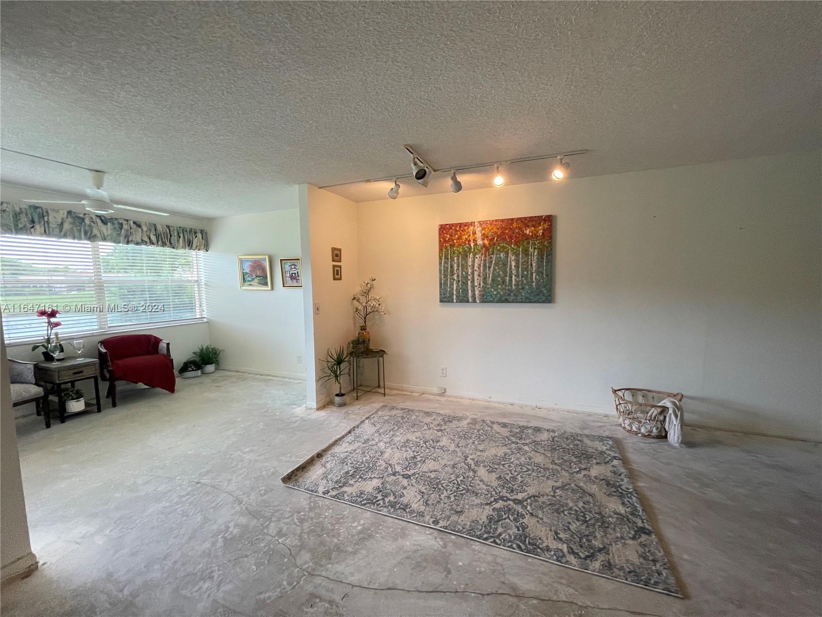 a view of livingroom with furniture and a window