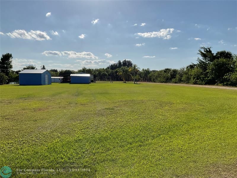 a view of an ocean and a yard