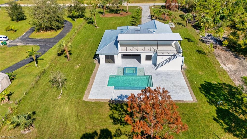 an aerial view of a house with a garden