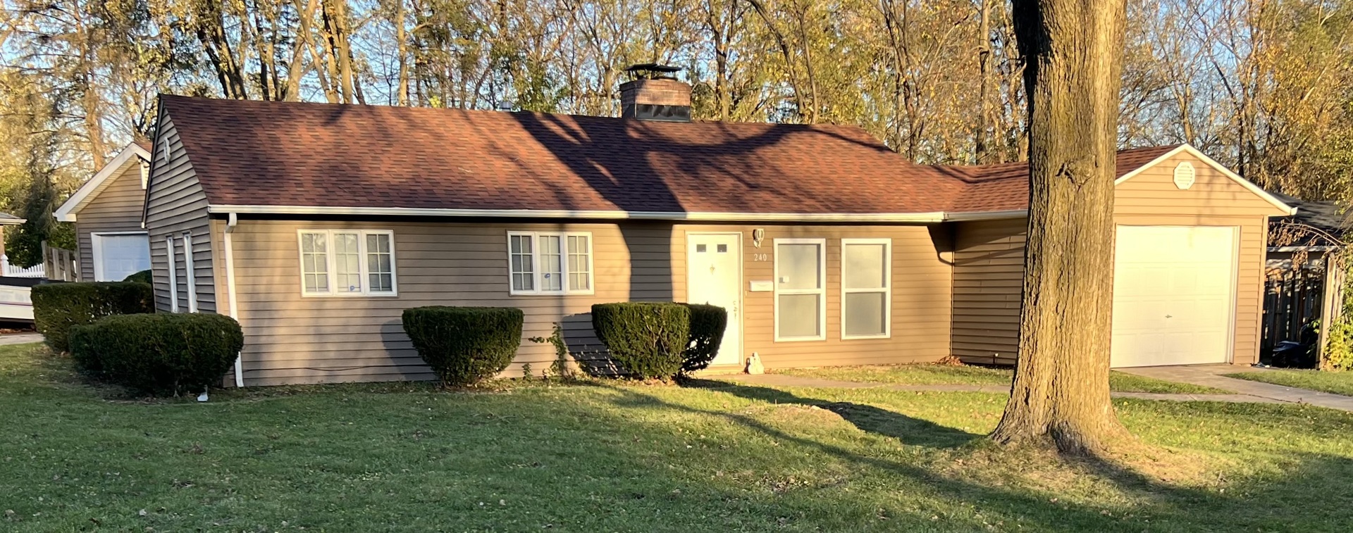 a view of house that has a yard