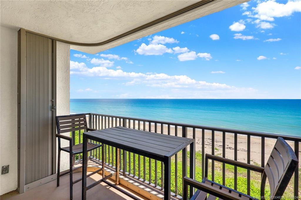 a view of a balcony with furniture