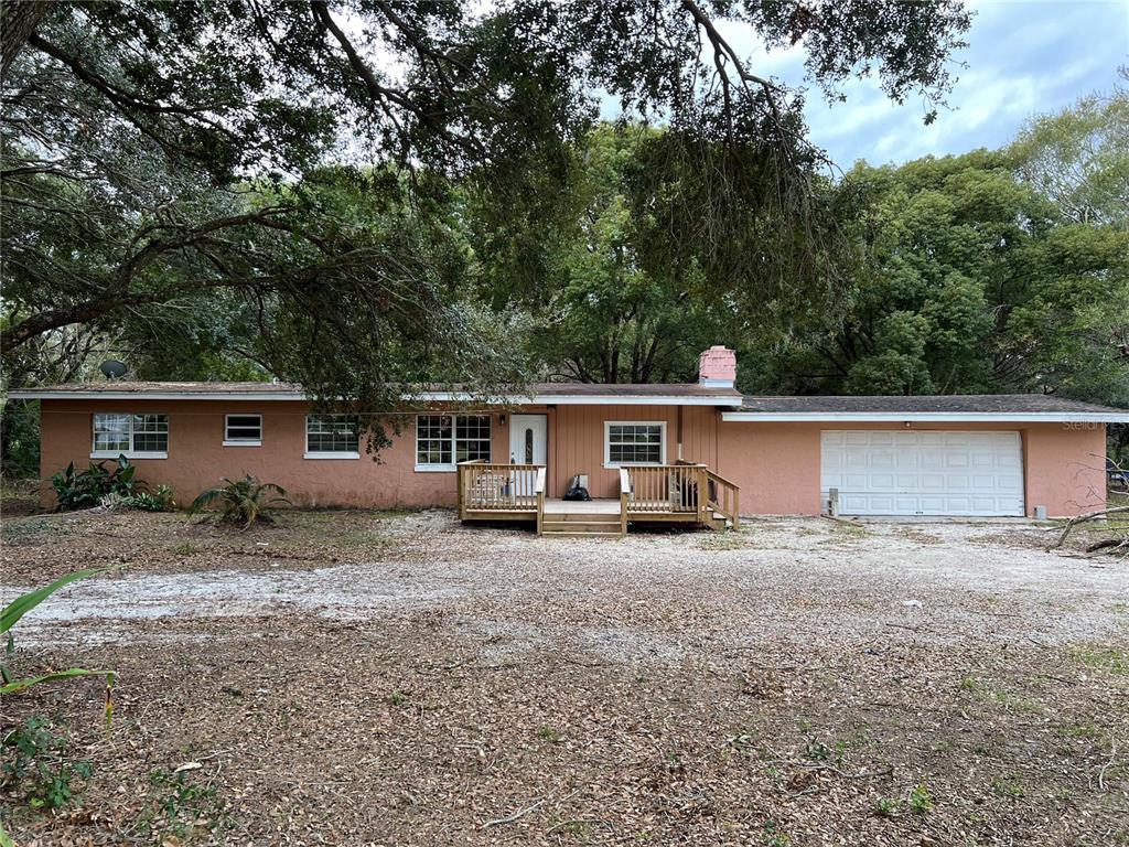 a view of a house with backyard space