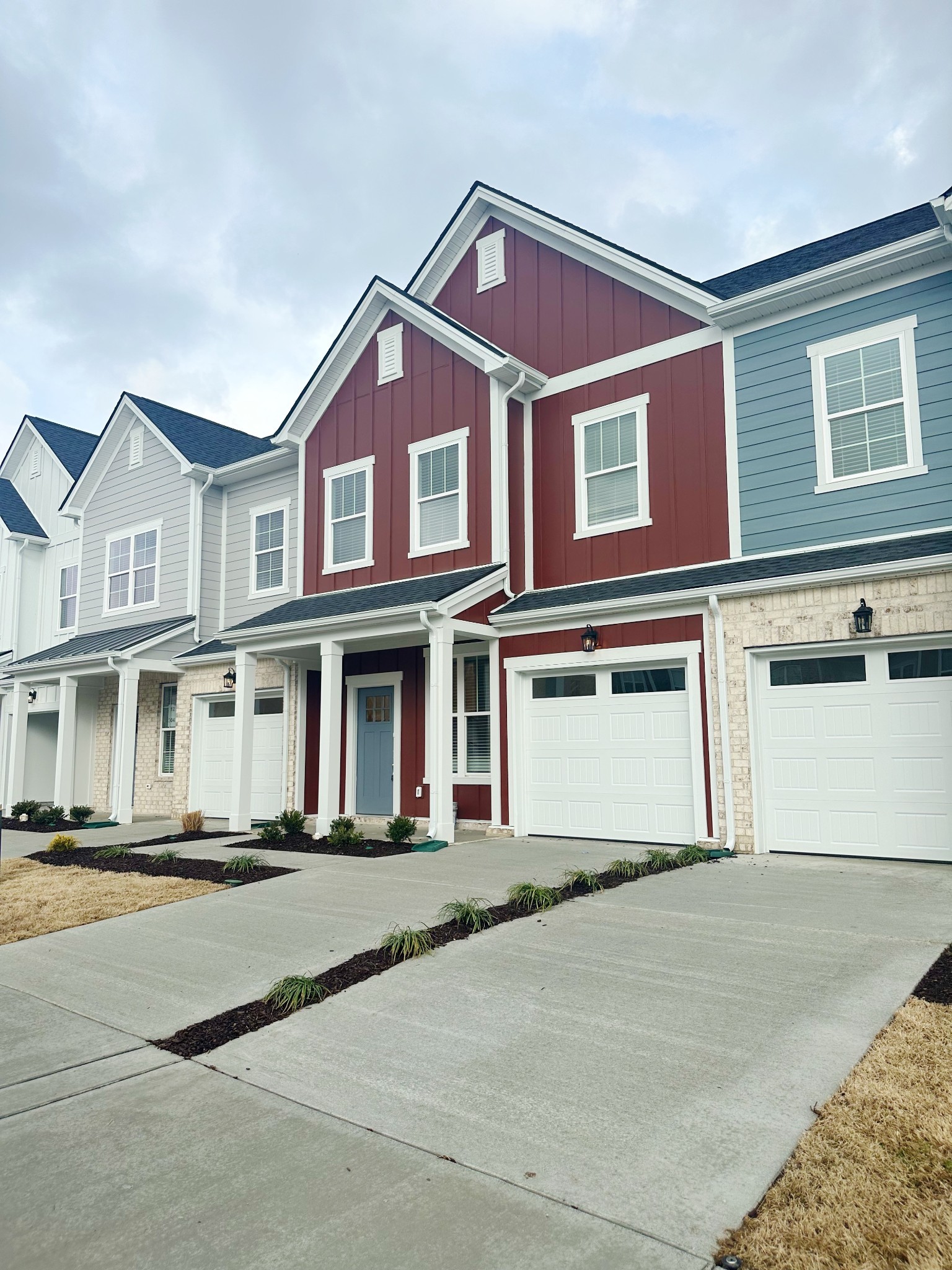 Photo is of a previous Townhome Built. 321 Carver Connection will have Booth Bay Blue Hardie with White Trim. Estimated Completion 02/10/2025.