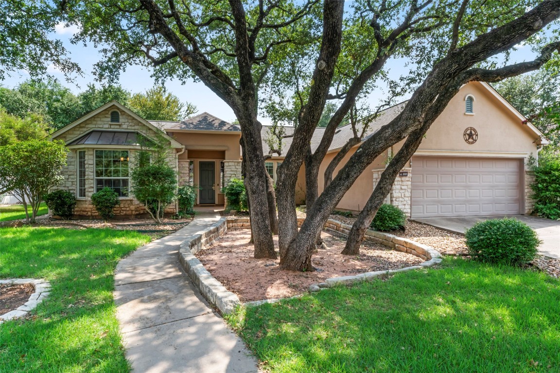 a front view of a house with garden