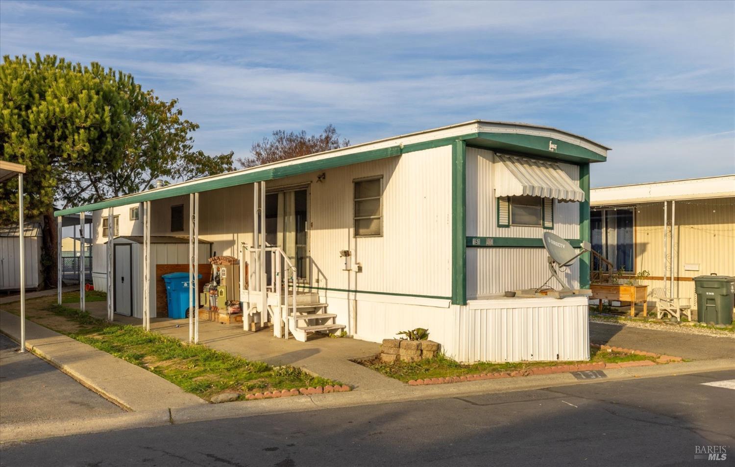 a view of a house with a sink and yard