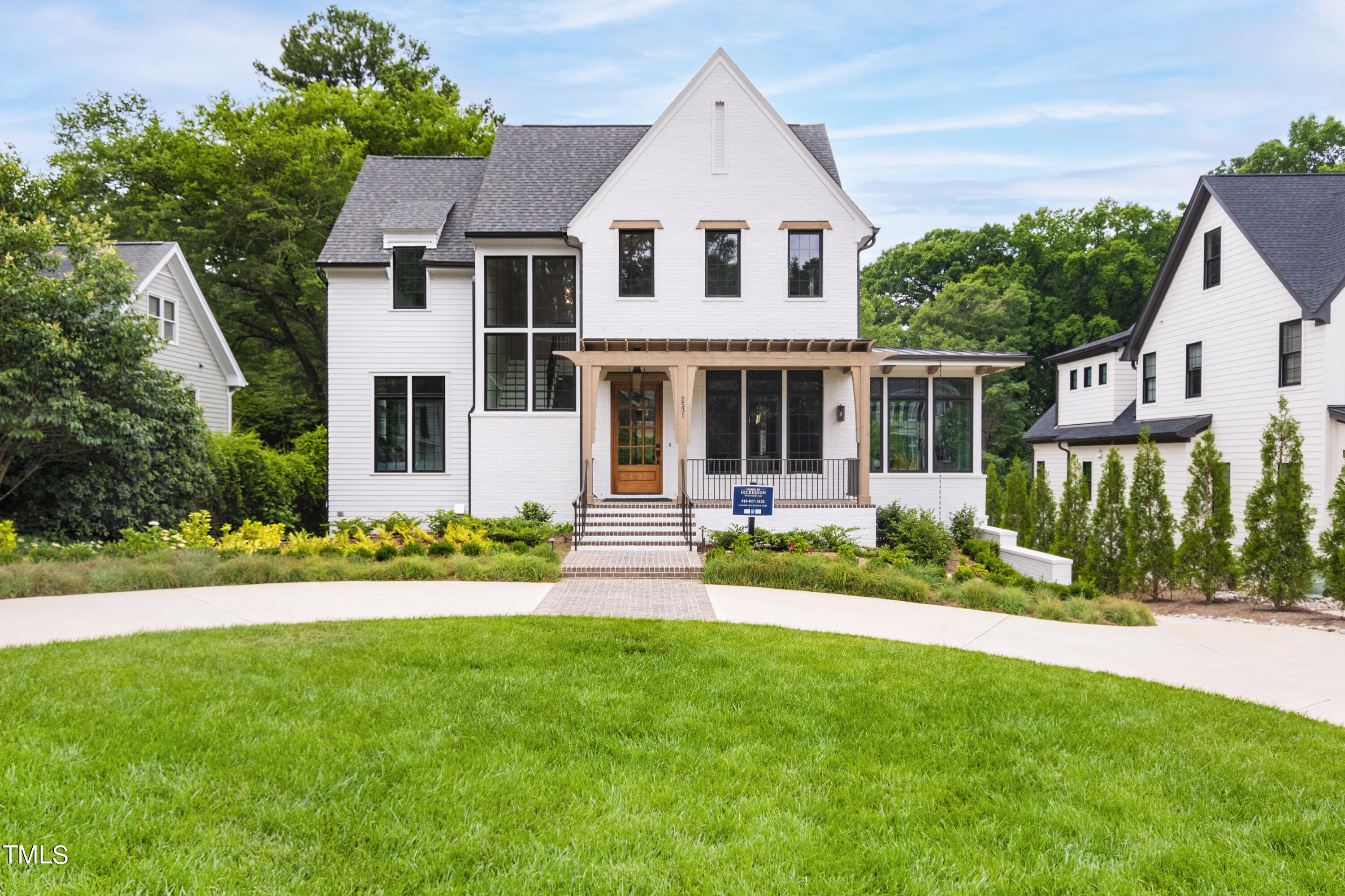 front view of a house with a yard