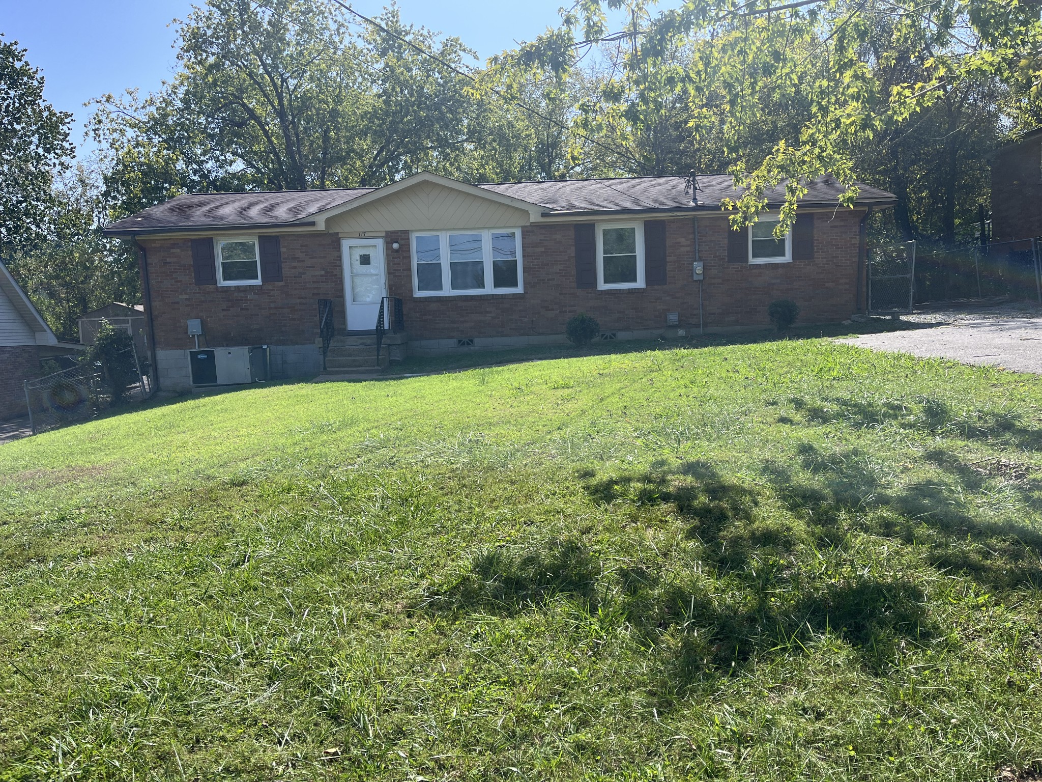 a view of a house with a backyard