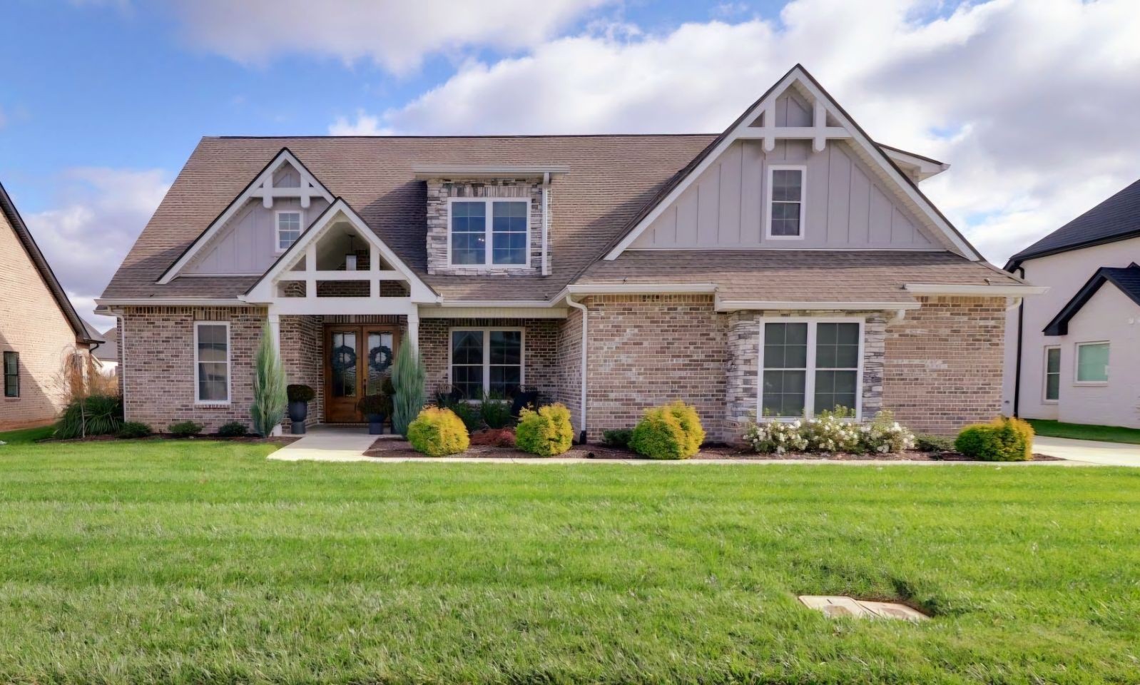 a front view of a house with garden