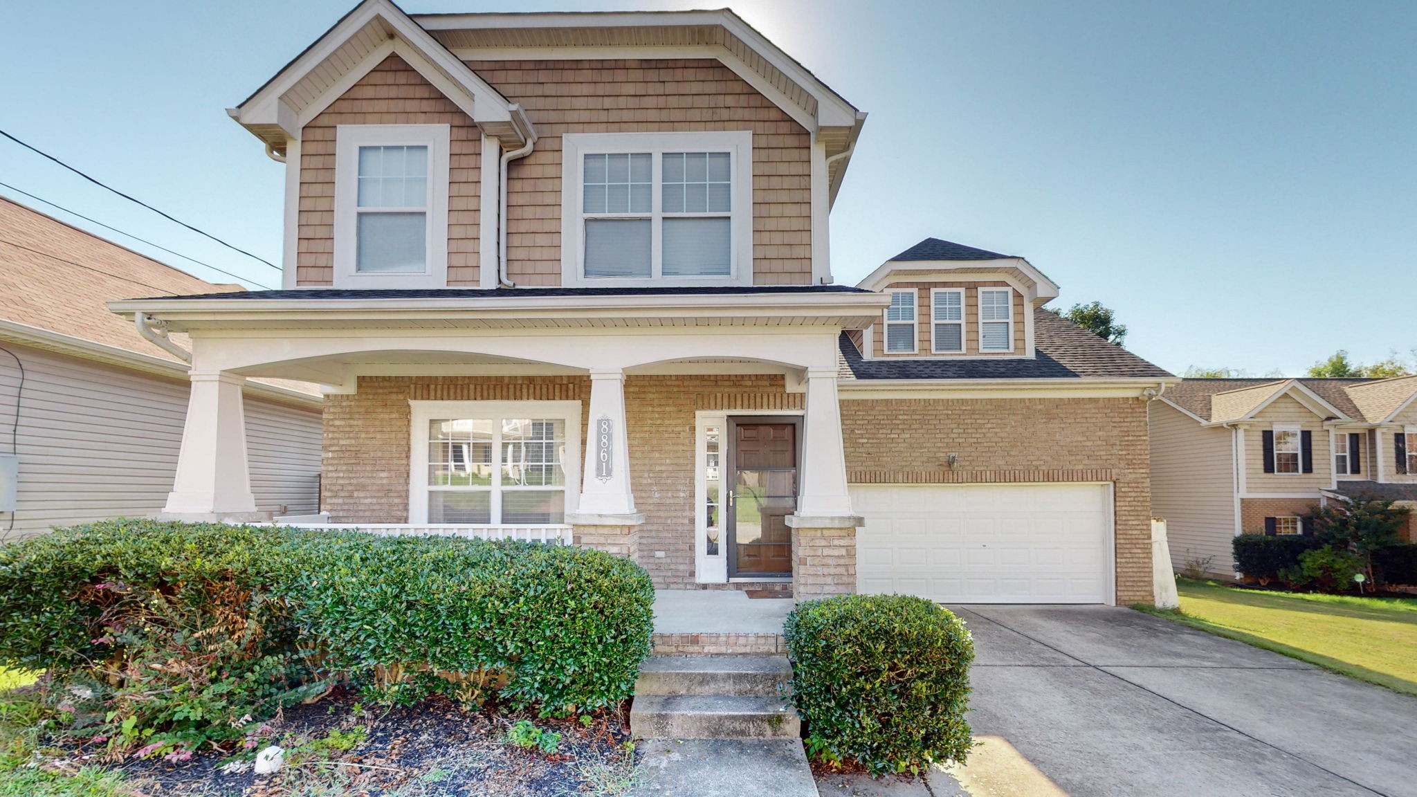 front view of a house with a yard