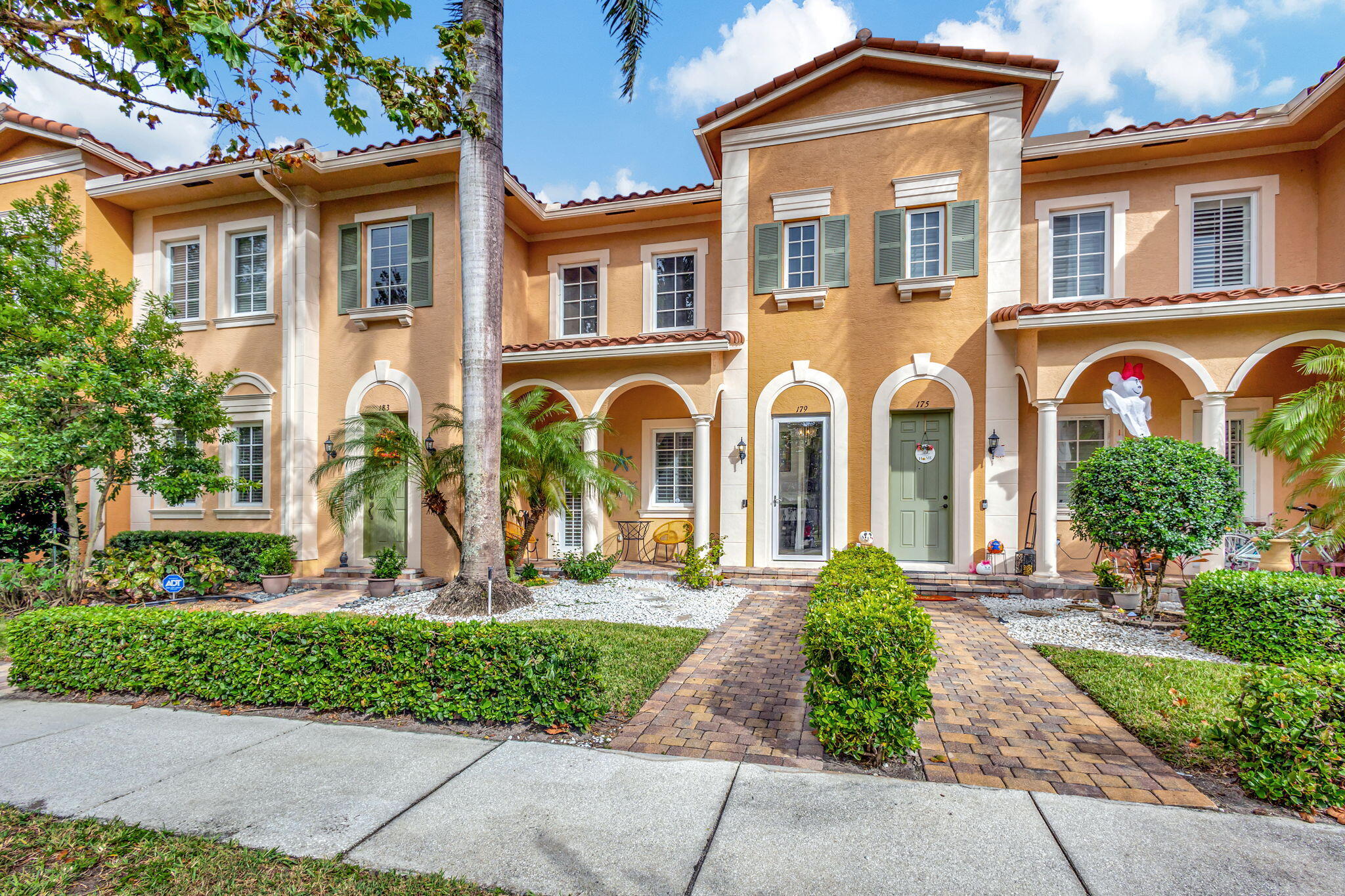 front view of a house with a garden