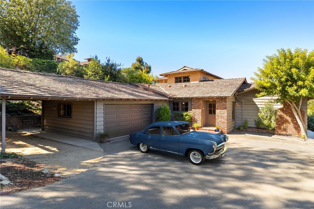 a view of a car in front of house