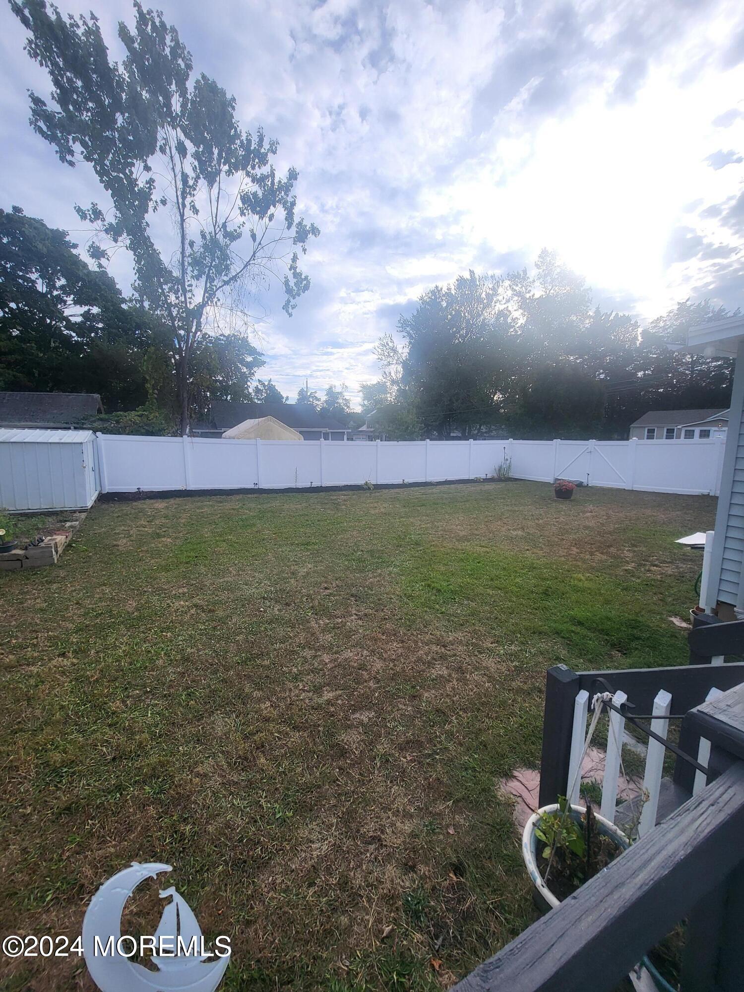 a view of a yard with an outdoor space