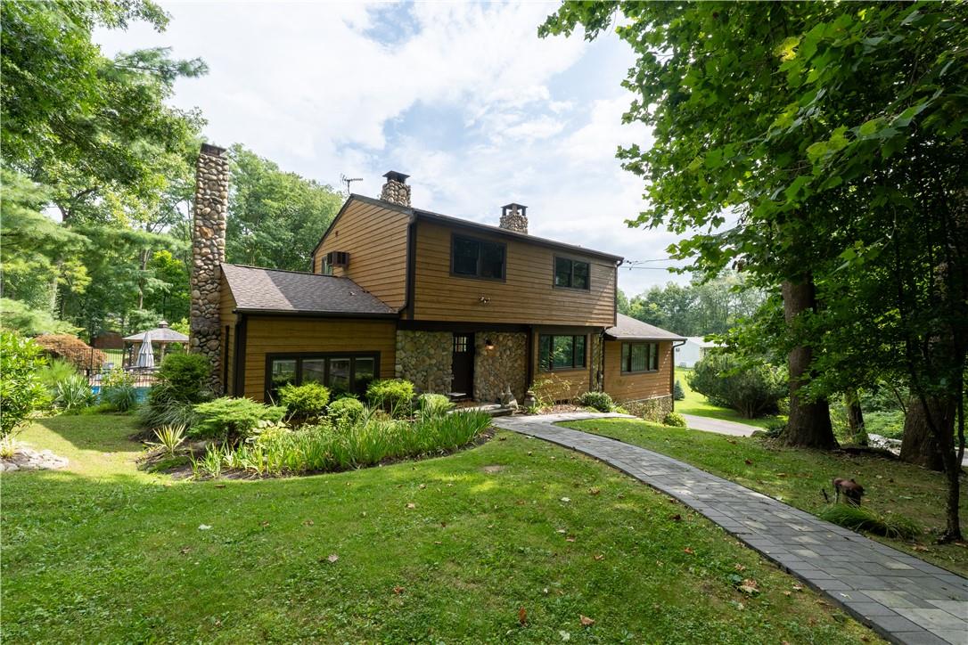 View of front of property with a front yard