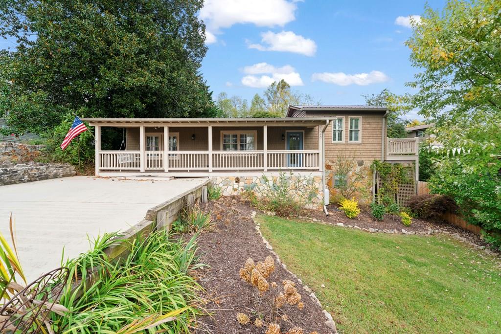 a front view of a house with garden