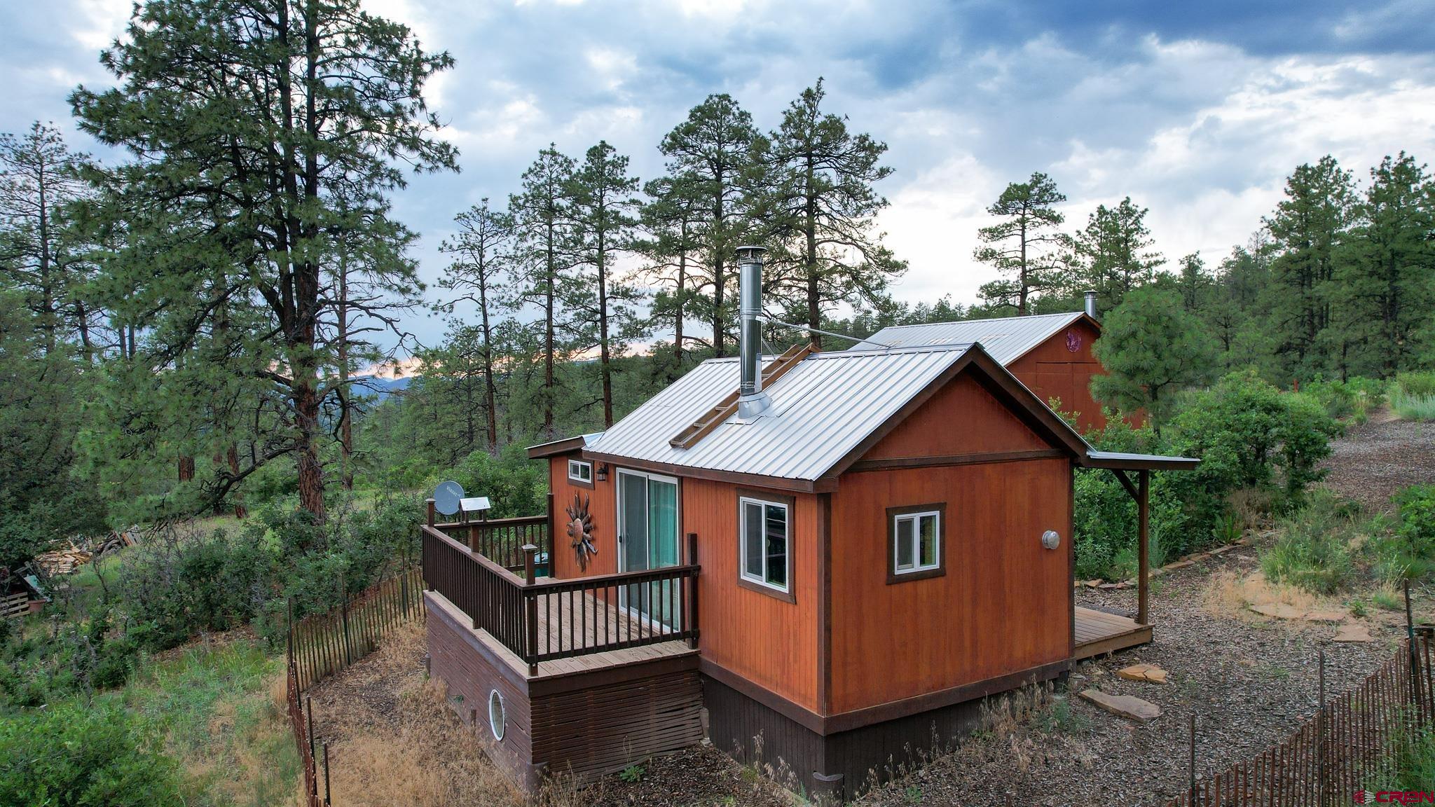 a view of house with backyard