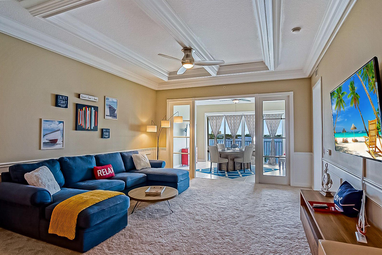 a living room with furniture and a flat screen tv