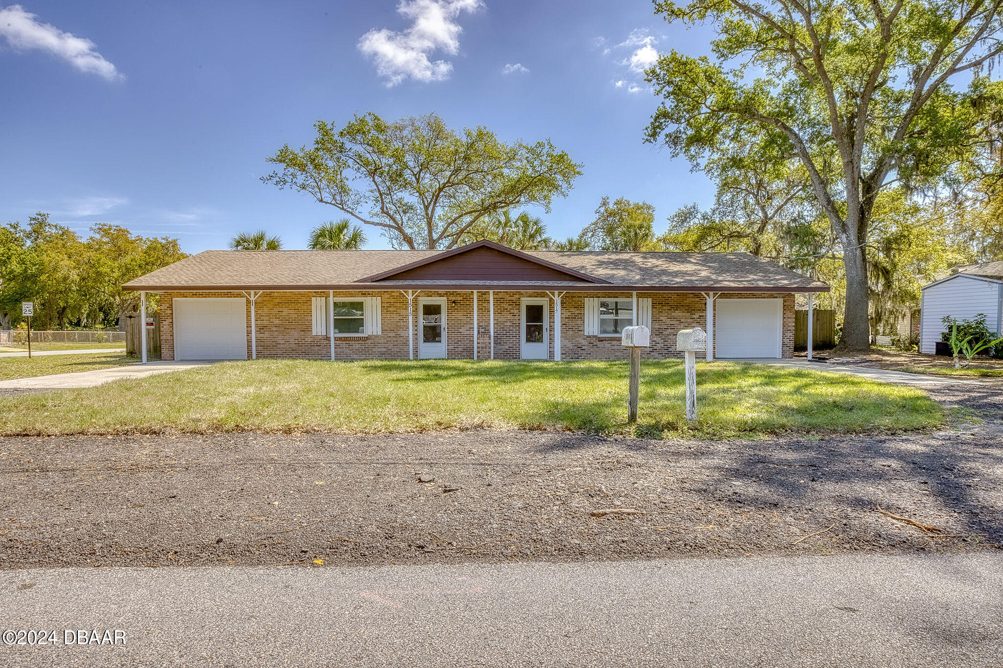 a view of front a house with a yard