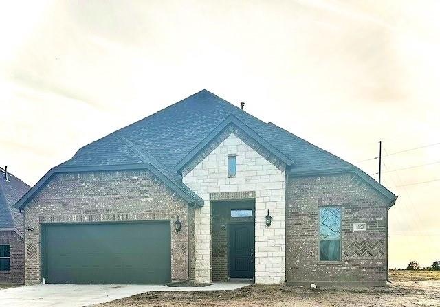 a front view of a house with a garage