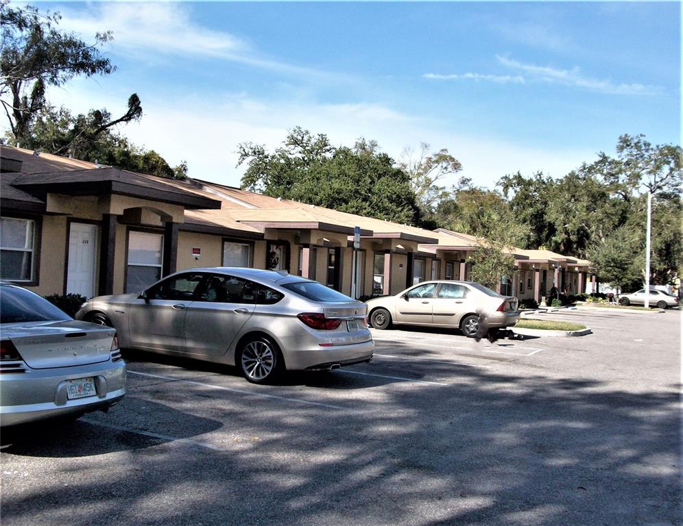 a view of street with parked cars