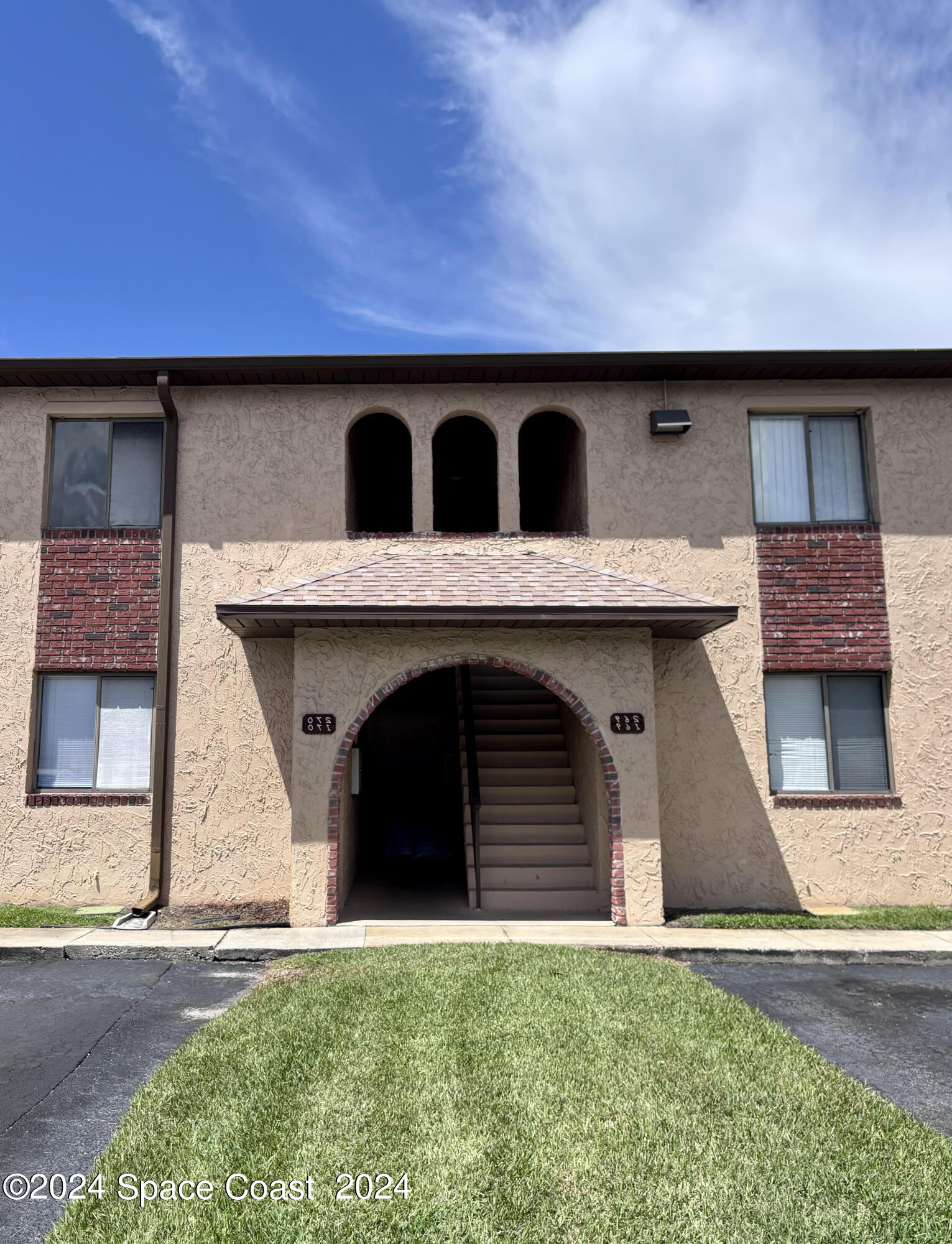 a front view of a house with a garage