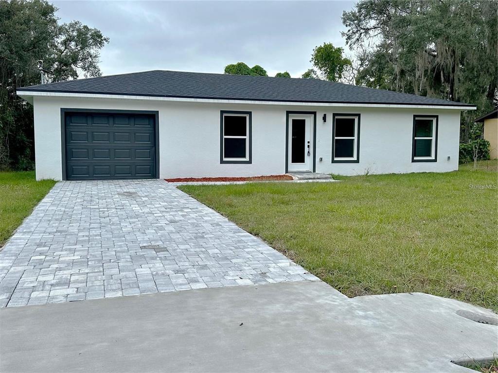 front view of a house with a yard