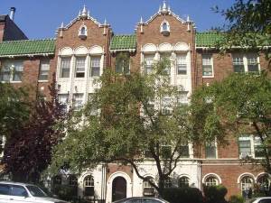 a front view of a building with garden