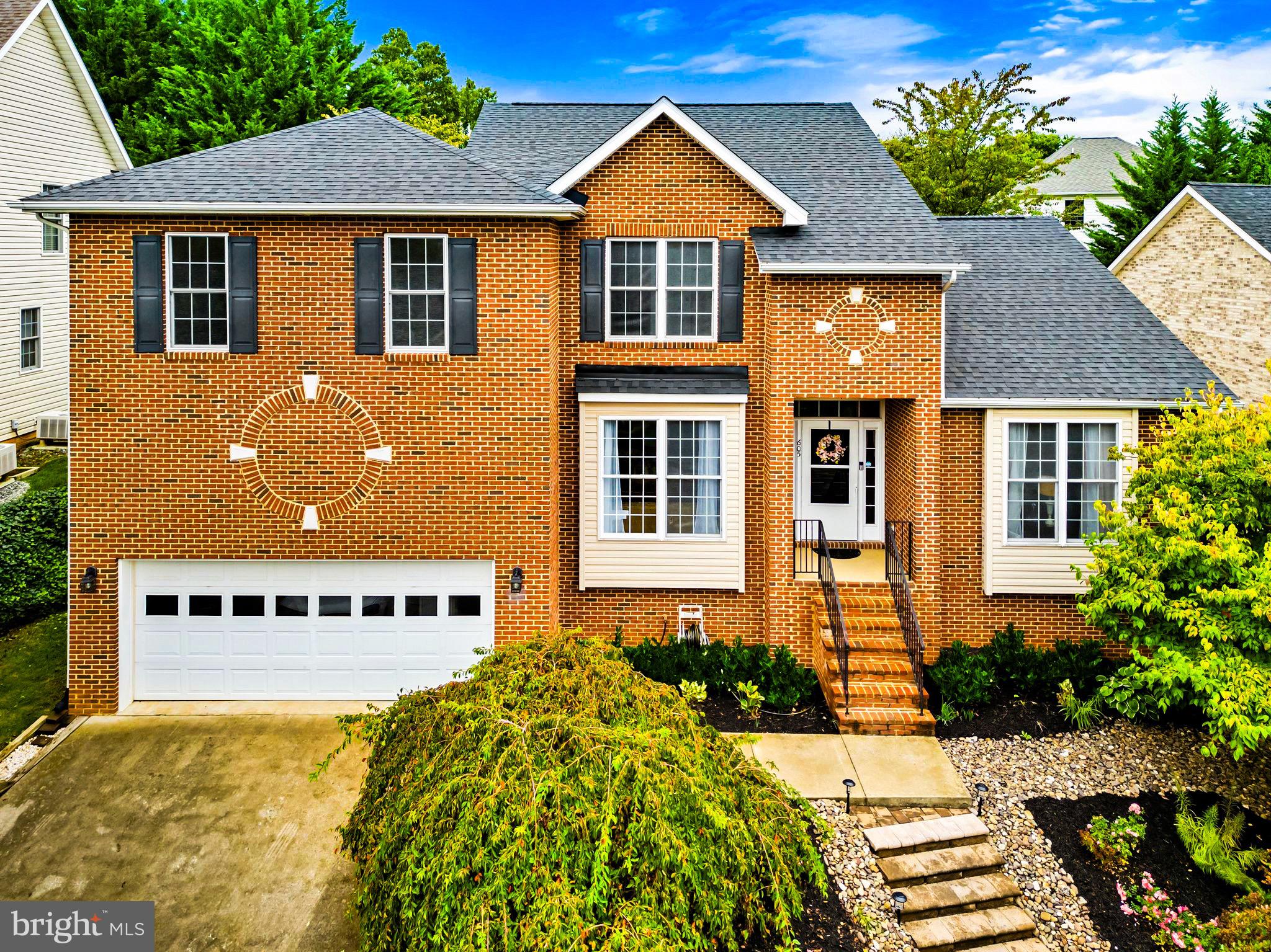 front view of a house with a yard