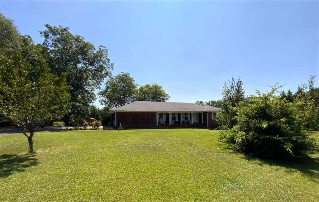 a view of a house with a big yard