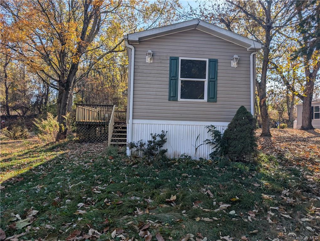 View of side of home with a deck